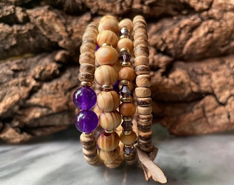 Duskhunter: Four tiers. Stacked wood, gemstone, crystal fragrance diffuser bracelet. Memory wire. One piece. Fits anybody.