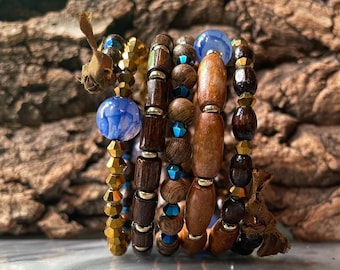Glaucos: Five tiers. Stacked wood, gemstone, crystal fragrance diffuser bracelet. Memory wire. One piece. Fits anybody.