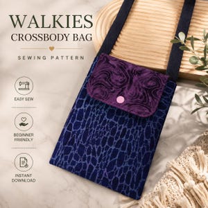 May include: A crossbody bag sewing pattern titled WALKIES CROSSBODY BAG. The bag features a dark blue fabric with a black textured pattern, a purple marbled flap with a pink snap button, and a black strap. Text includes EASY SEW, BEGINNER FRIENDLY, and INSTANT DOWNLOAD.