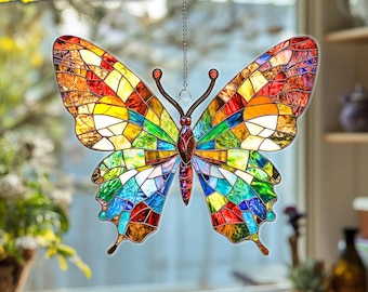 May include: A colorful, stained-glass style butterfly decoration. The butterfly features a mosaic of vibrant colors including red, orange, yellow, green, blue, and purple. It is suspended by a chain and has the text "2D FLAT ONLY".