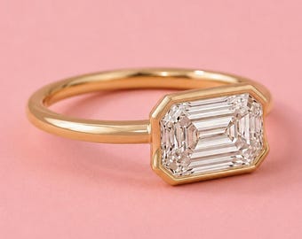 Anel com diamante de laboratório de 2 quilates com lapidação esmeralda, cravação horizontal, em ouro 10K, 14K e 18K.