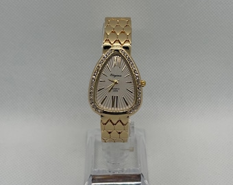 Vintage gouden dameshorloge, quartz uurwerk met druppelvormige wijzerplaat en strass-steentjes, elegante roestvrijstalen armband, chique retro sieradenhorloge