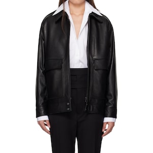 Shop our oversized women's leather jacket, crafted from soft, premium leather for a chic, comfortable fit. This trendy vintage-inspired outerwear is perfect for layering in fall and winter. Its relaxed, oversized design offers a casual yet stylish look, making it ideal for everyday wear. Versatile and cozy, this leather jacket is a must-have wardrobe staple. Perfect for fashion lovers seeking edgy, timeless pieces to elevate their outfit. Great gift idea!