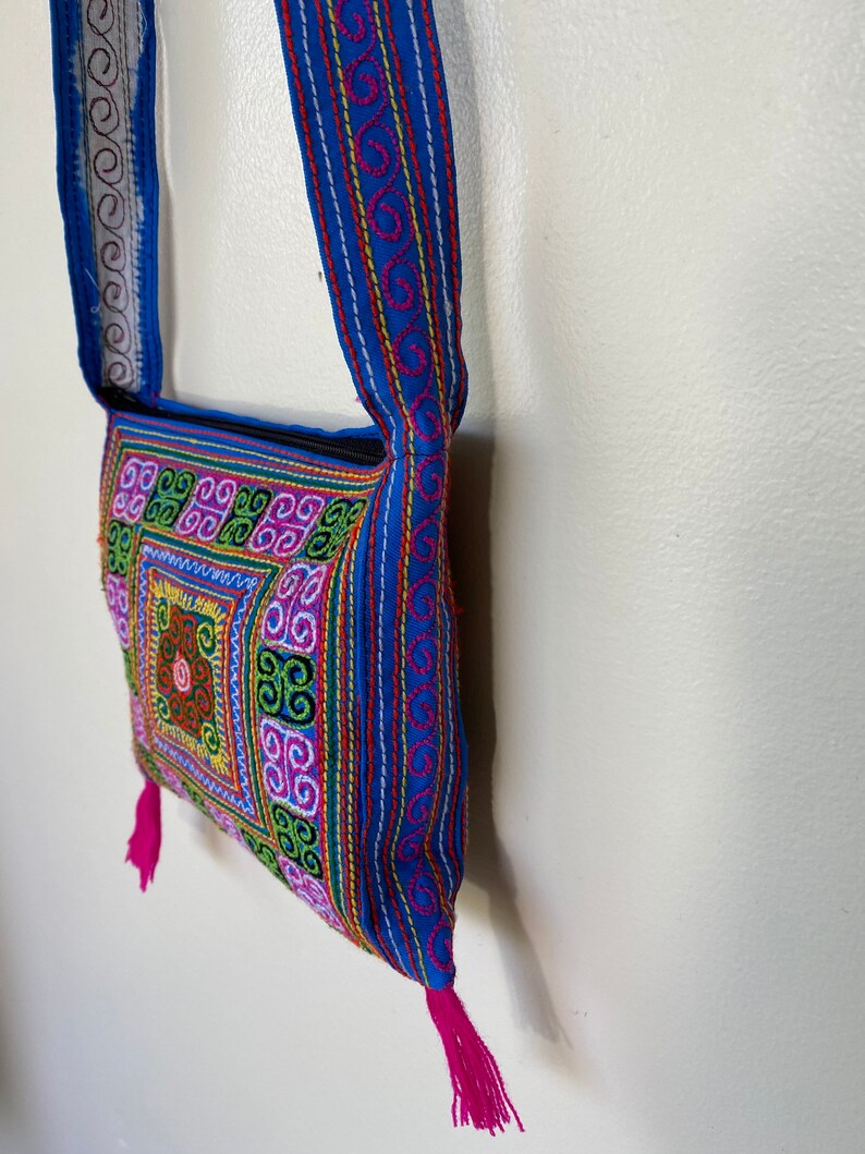 Thai embroidered cross body purse with zipper and fringe pink and blue colorful stitching zipper closure