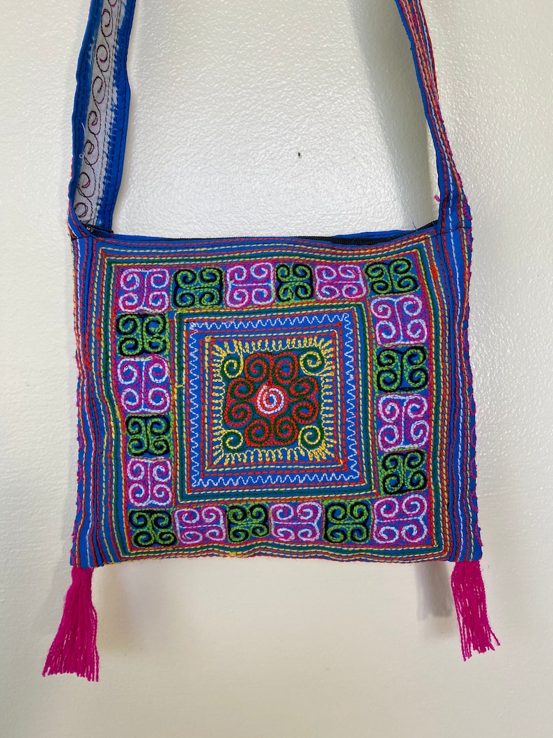 Thai embroidered cross body purse with zipper and fringe pink and blue colorful stitching zipper closure