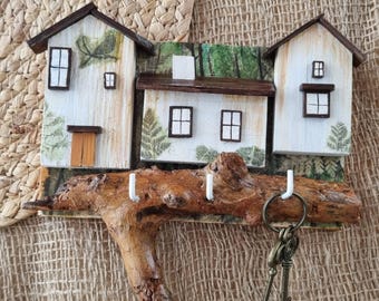This unique wall key holder "In the Forest" with a forest theme is made from eco-friendly materials using decoupage.