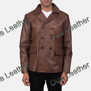 May include: A brown leather jacket with a double-breasted design. The jacket has a notched collar, two front pockets, and button closures. The sleeves are long, and the jacket appears to be well-fitted.