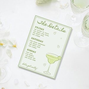 May include: A light green rectangular card with the words "The Details" in cursive. The card lists a weekend itinerary with a margarita illustration and the phrase "Let's get salty!" in a script font.