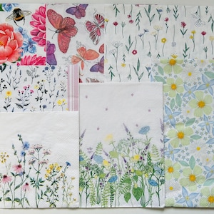 May include: A set of 10 paper napkins with floral designs. The napkins feature various floral patterns, including butterflies, bees, and flowers in shades of pink, blue, green, and yellow.