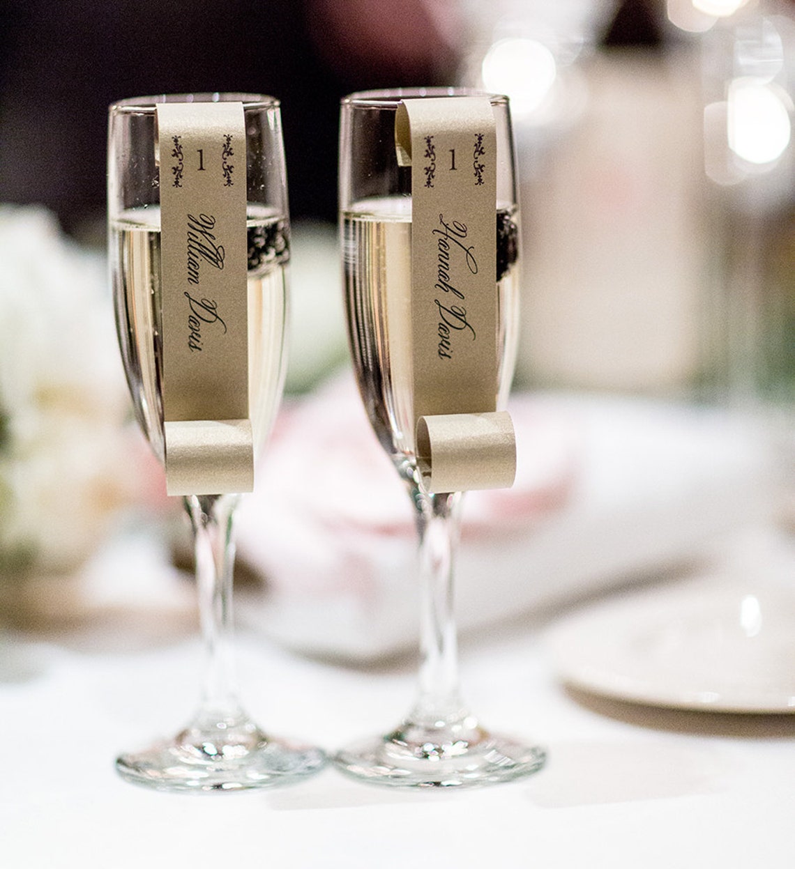 Sample of Champagne Flute Escort Cards as seen on 100 Layer Etsy