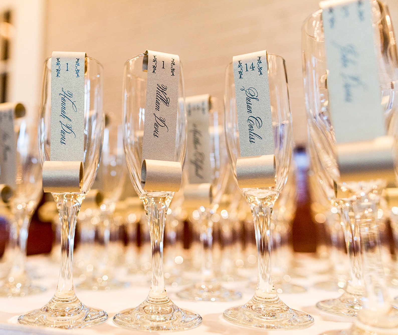 Sample of Champagne Flute Escort Cards as seen on 100 Layer Etsy
