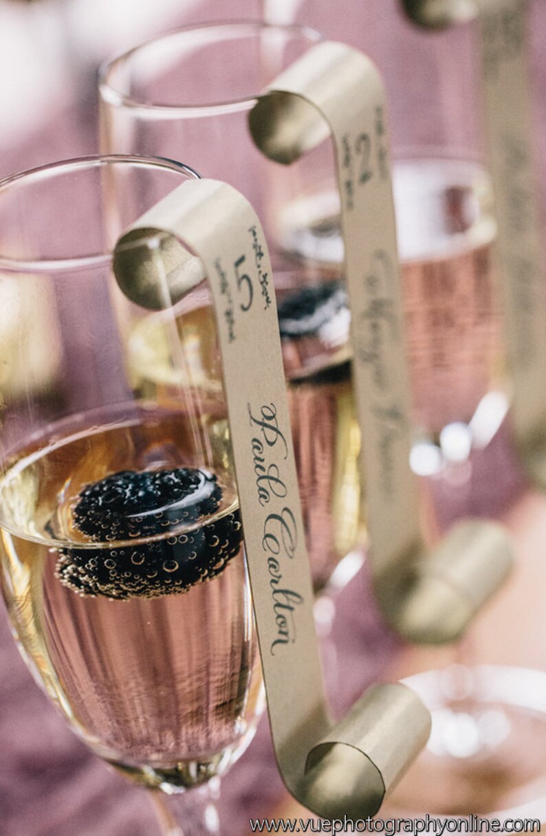 Sample of Champagne Flute Escort Cards as seen on 100 Layer Etsy