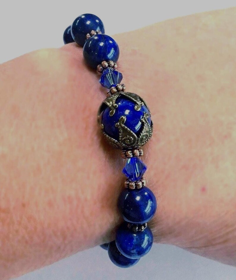 a lapis bracelet shown on a women’s wrist