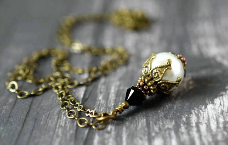 Victorian Pearl Necklace with Black Crystal - White Pearl Pendant On Antique Gold Chain - Tuxedo Wedding

Handmade Jewelry by MsBsDesigns.Etsy.com