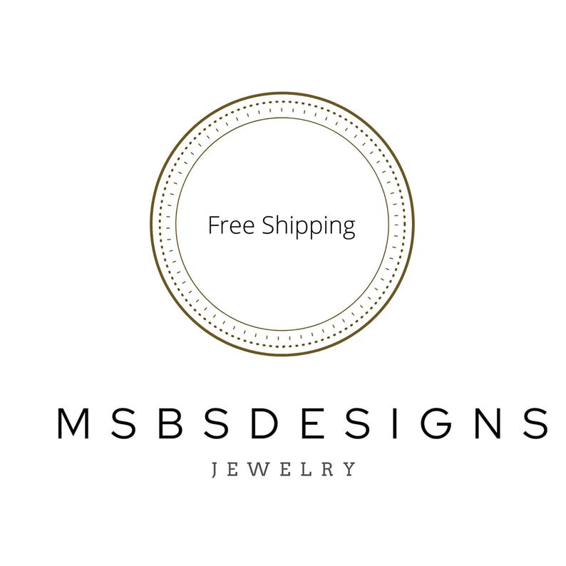 May include: A circular logo featuring a thin brown outline with a dashed inner border. Inside the circle, the text reads Free Shipping. Below the circle, the text MSBS DESIGNS is printed in a bold, black, sans-serif font, followed by JEWELRY.
