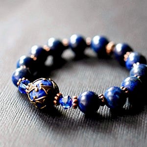 Victorian style lapis bracelet. Stretch bracelet created with lapis lazuli gemstones, Swarovski crystals, and gold beads. Handmade by msbsdesigns.