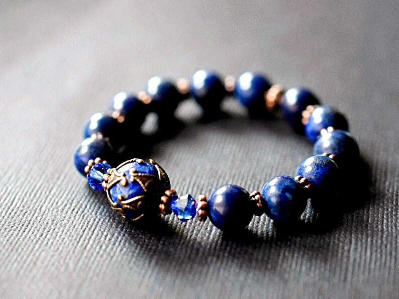 Victorian style lapis bracelet. Stretch bracelet created with lapis lazuli gemstones, Swarovski crystals, and gold beads. Handmade by msbsdesigns.