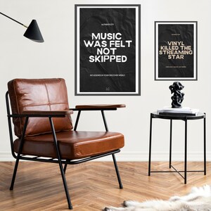 May include: Two black framed posters with white text on a crumpled black background. The left poster reads "Authenticity Music Was Felt Not Skipped No Legends In Your Discover Weekly". The right poster reads "Vinyl Killed The Streaming Star When Music Was Not Skipped".