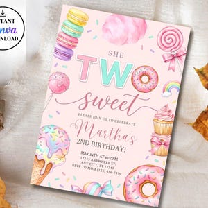 May include: A rectangular birthday invitation card with a light pink background featuring illustrations of macarons, cotton candy, a lollipop, a rainbow, cupcakes, ice cream, and donuts. The text reads: SHE TWO sweet PLEASE JOIN US TO CELEBRATE Martha's 2ND BIRTHDAY! MAY 24TH AT 4:00PM 12345 ANYWHERE ST. ANY CITY, ST 12345 RSVP TO MOM (123) 456-7890.
