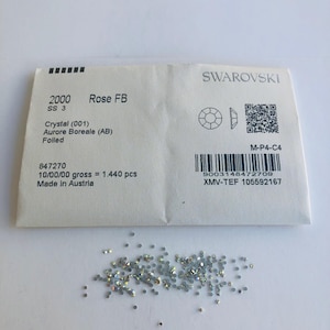 May include: A set of three ceramic mugs with a speckled, matte finish in cream, light grey, and dark grey. Each mug has a simple, minimalist design, suitable for coffee or tea.