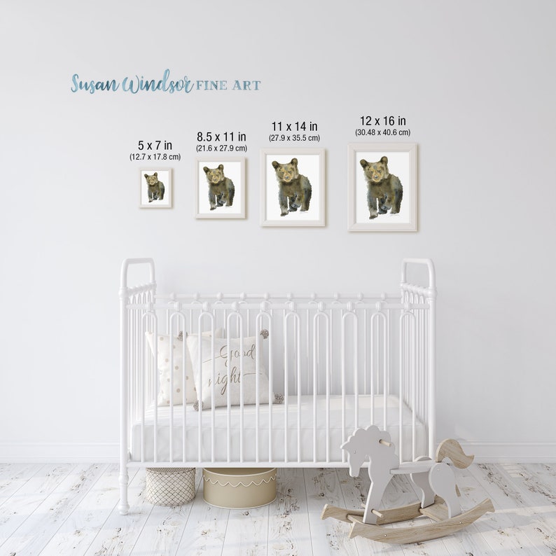 May include: Four framed prints of a watercolor painting of a brown bear cub. The prints are displayed on a white wall above a white crib. The prints are available in four sizes: 5x7 inches, 8.5x11 inches, 11x14 inches, and 12x16 inches.