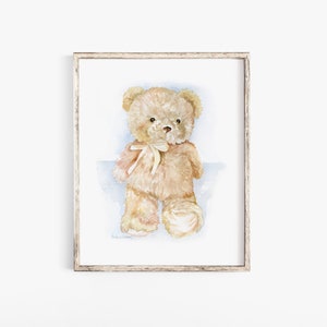 May include: A watercolor painting of a light brown teddy bear with a white bow. The bear is sitting on a light blue background.
