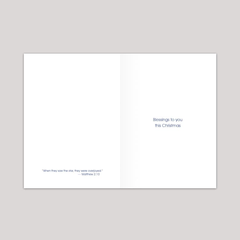 May include: A white card with blue text. The text reads "When they saw the star, they were overjoyed." - Matthew 2:10. The card also reads "Blessings to you this Christmas".