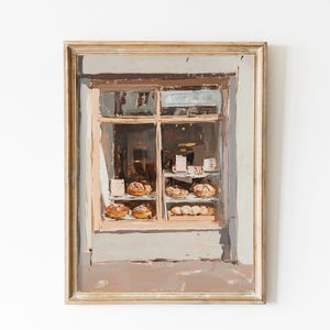 Puede incluir: Pintura al óleo de un escaparate de panadería con diversos productos horneados en exhibición. La pintura tiene una paleta de colores apagados de marrones, beiges y grises, con un marco de madera. La ventana está dividida en cristales.