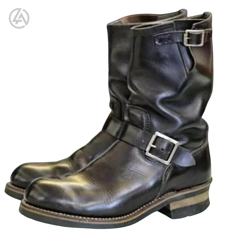 Men’s black leather engineer boots with buckle straps, mid-calf motorcycle biker boots made from genuine leather, front and side view on white background