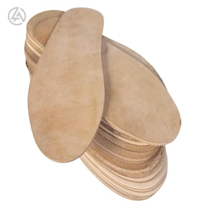 May include: A stack of beige-colored shoe insoles. The insoles are oval-shaped, with a slightly curved design to fit the foot. The insoles are made of a soft, flexible material, and are stacked on top of each other.