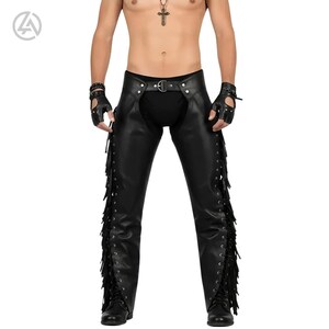 May include: Black leather chaps with fringe detailing along the sides. The chaps feature a belt with a silver buckle and are designed with a cutout at the waist. The image also shows black fingerless gloves and boots.