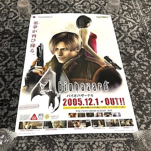 May include: A poster for the video game Resident Evil 4, featuring the main character Leon S. Kennedy holding a gun and a woman in a red dress. The poster is in Japanese and English and includes the text "biohazard" and "2005.12.1 OUT!"