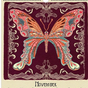 May include: A wall calendar featuring a detailed butterfly illustration with orange, pink, and teal wings against a deep burgundy background. The calendar is for November, with dates displayed in a grid format.