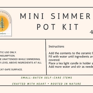 May include: A beige label for a Mini Simmer Pot Kit, with text including "Mini Simmer Pot Kit" and "4 oz." Instructions and warnings are also listed. The label includes a logo with trees and the text "Crafted with Heart Rooted in Nature."