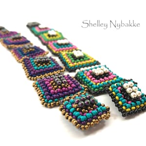 May include: Two pairs of colorful beaded earrings with geometric patterns. The earrings are made with small, round beads in shades of turquoise, pink, purple, gold, black, and white. The earrings are designed in a square shape with a layered effect.