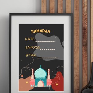 May include: Printable Ramadan calendar with a black background and a colorful illustration of a mosque. The calendar has spaces to fill in the date, sahoor, and iftar times.