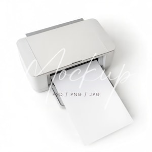 May include: A white printer with a sheet of white paper emerging from the output tray. The printer is on a white background. Text on the paper reads "PSD / PNG / JPG".
