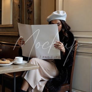 May include: A woman wearing a light blue beret and a black fur coat sits in a cafe reading a white newspaper with the text "Mockup PSD / PNG / JPG".