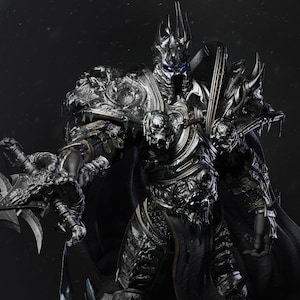May include: A black and silver armoured figure with a crown and a sword. The figure has a menacing expression and is wearing a long black cape.