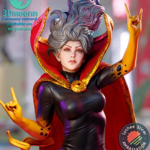 May include: A close-up of a female figure with long, silver hair, wearing a black bodysuit with a red and gold cape. She has a large, golden eye on her chest and is making a rock and roll hand gesture with both hands. The figure is a 3D printed model and is part of a collection of figures available on Patreon.