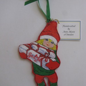 Handcrafted Christmas Ornament, Swedish TINY SANTA BOY with package, Paper-Mache' ornament.