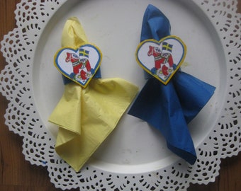 A pair of Napkinholders with Swedish Dalahorses ,Handcrafted from recycled paper. Can be personalized.