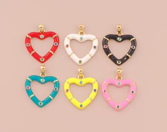May include: Six heart-shaped pendants in various colors: red, white, black, teal, yellow, and pink. Each pendant has a gold-colored bail and is adorned with colorful gemstones. The pendants are likely for jewelry making.