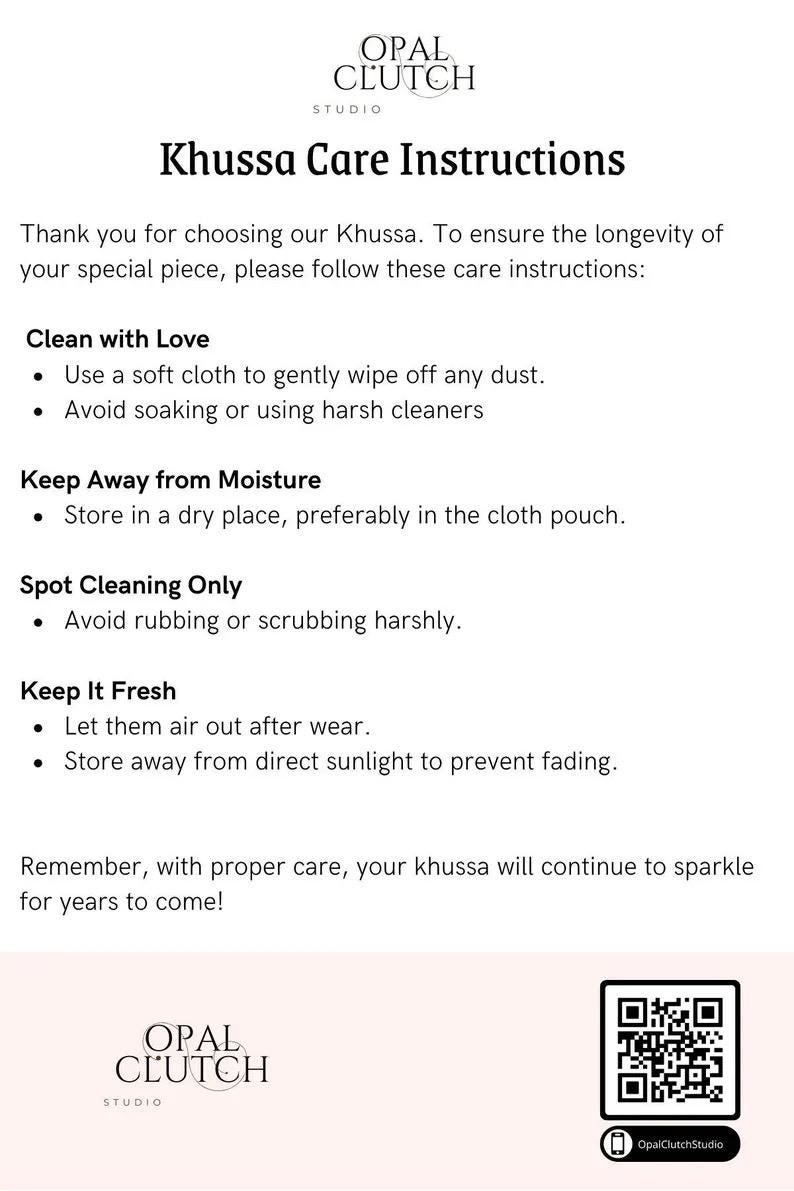 May include: White informational card with the text "Khussa Care Instructions" from Opal Clutch Studio. Instructions include cleaning, moisture, spot cleaning, and keeping fresh. A QR code and the Opal Clutch Studio logo are at the bottom.