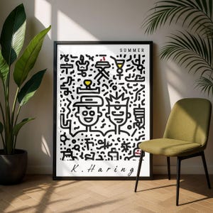 May include: A framed black and white art print featuring a Keith Haring-style illustration with the word "SUMMER" at the top. The artwork includes two stylized figures and various abstract shapes. The artist's signature, "K. Haring," is at the bottom.