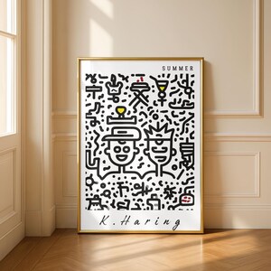 May include: A framed art print featuring a black and white illustration with the word "SUMMER" at the top. The artwork includes two stylized figures and various summer-themed icons. The artist's signature, "K. Haring," is at the bottom.