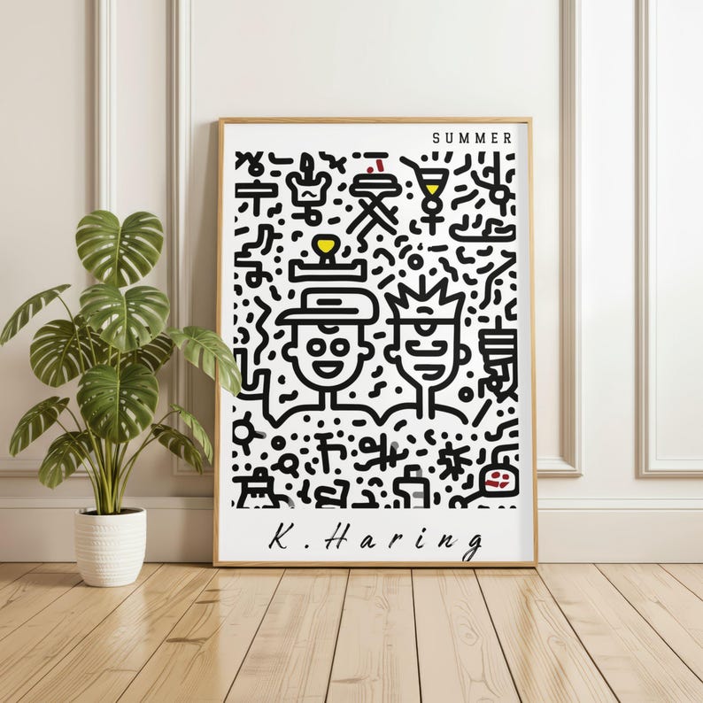 May include: A framed art print featuring a black and white Keith Haring-style illustration with the word "SUMMER" at the top. The artwork includes two stylized figures and various abstract shapes. The artist's signature, "K. Haring," is at the bottom.