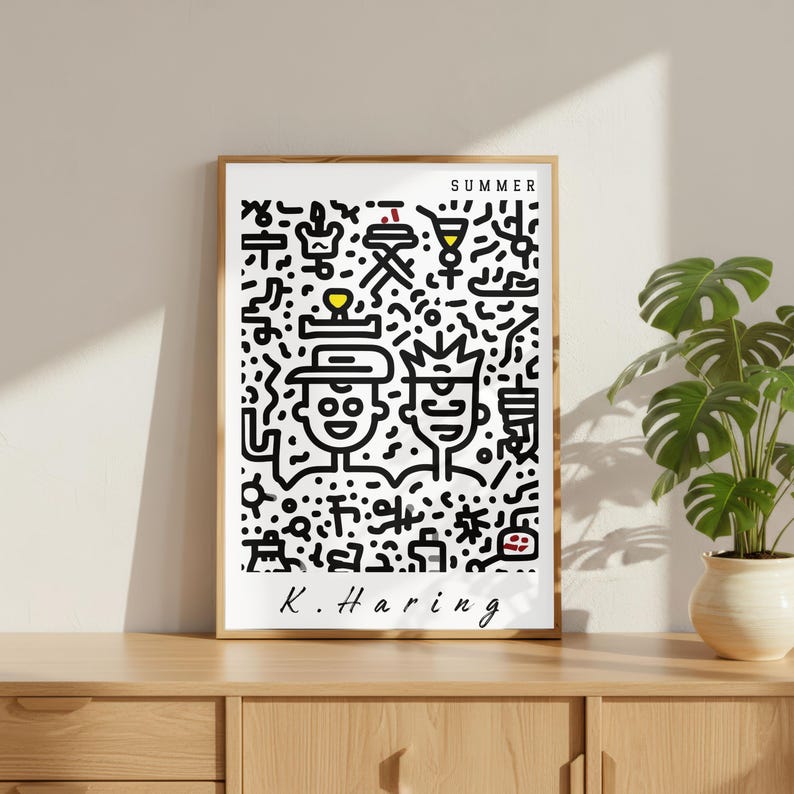 May include: A framed art print featuring a black and white Keith Haring-style illustration with the word "SUMMER" at the top. The artwork depicts two figures and various symbols. The artist's signature, "K. Haring," is at the bottom.