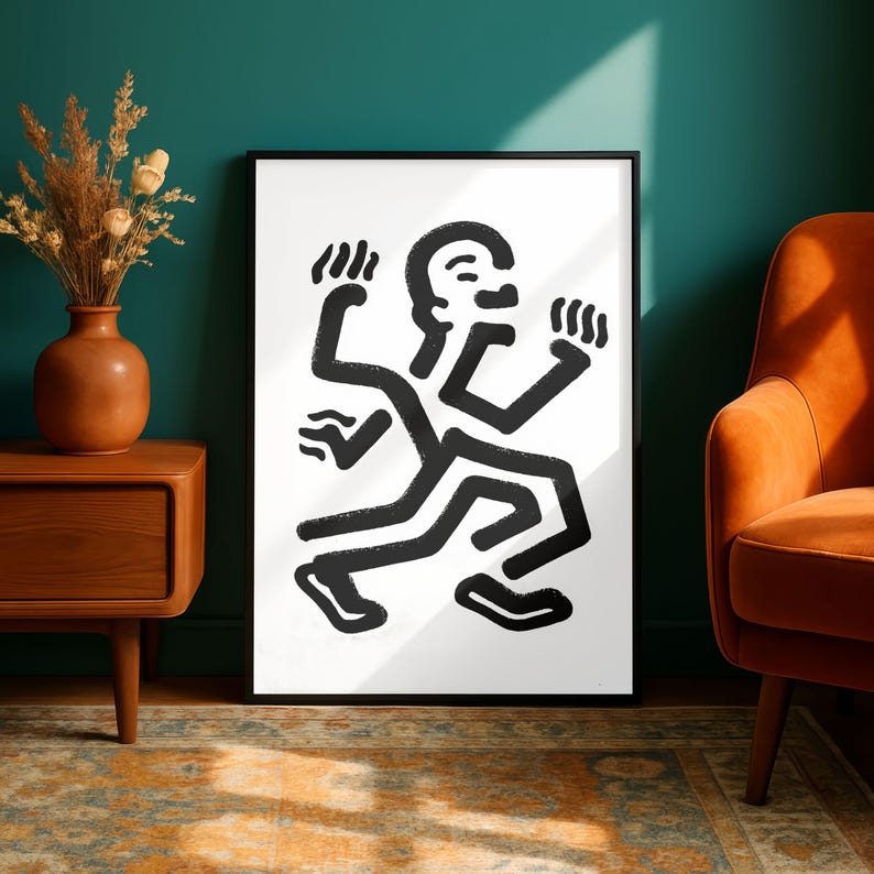 Puede incluir: L&aacute;mina art&iacute;stica enmarcada en blanco y negro con una figura estilizada en movimiento. La obra de arte utiliza l&iacute;neas gruesas y audaces. La impresi&oacute;n est&aacute; en un marco negro, adecuada para la decoraci&oacute;n de paredes moderna.