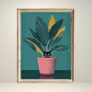 May include: Framed art print featuring a whimsical illustration of a black cat peeking out from a pink potted plant. The plant has large green and yellow leaves against a teal background. The frame is gold.